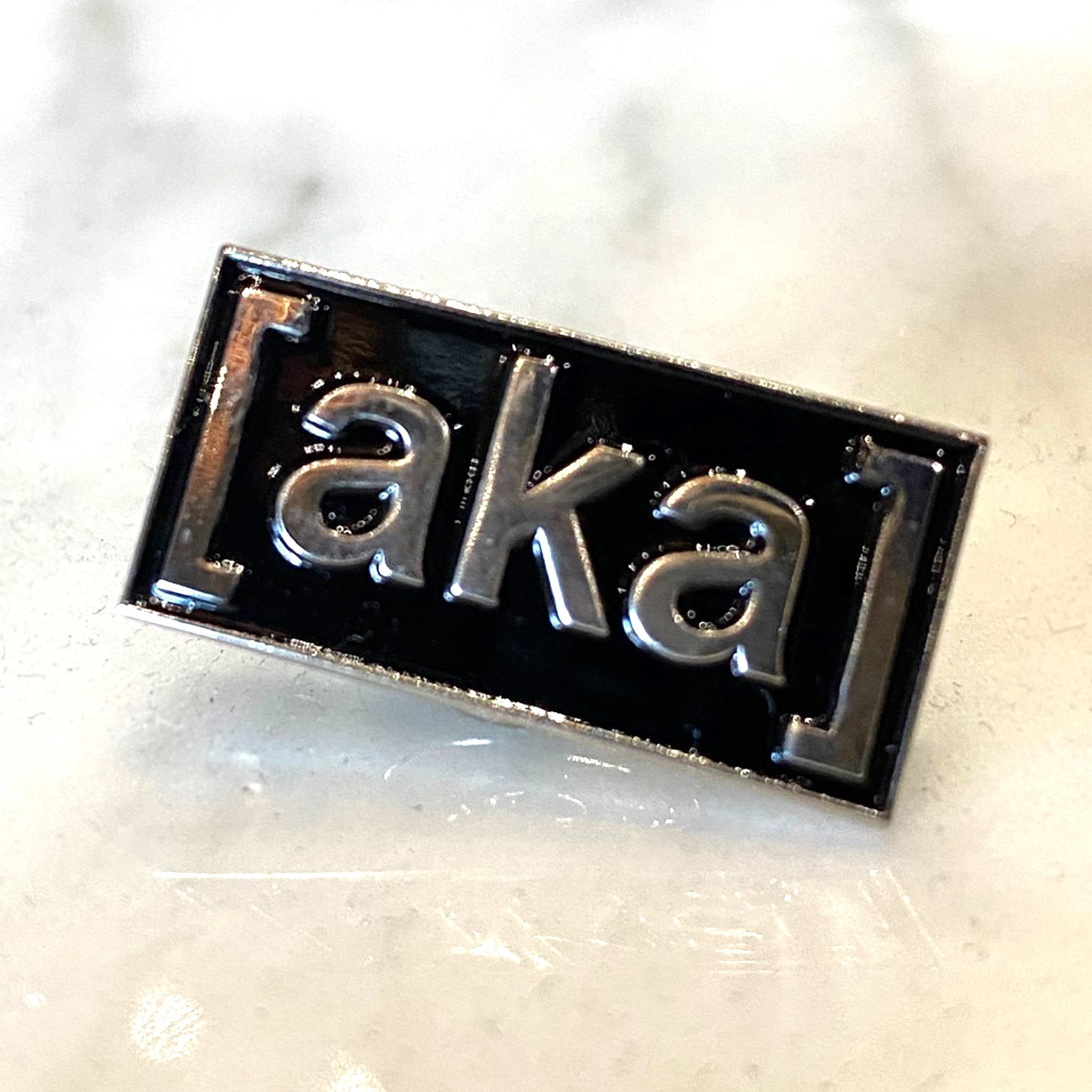 aka enamel pin - [aka]